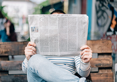 man holding a newspaper