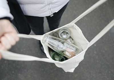 bag with glass to recycle